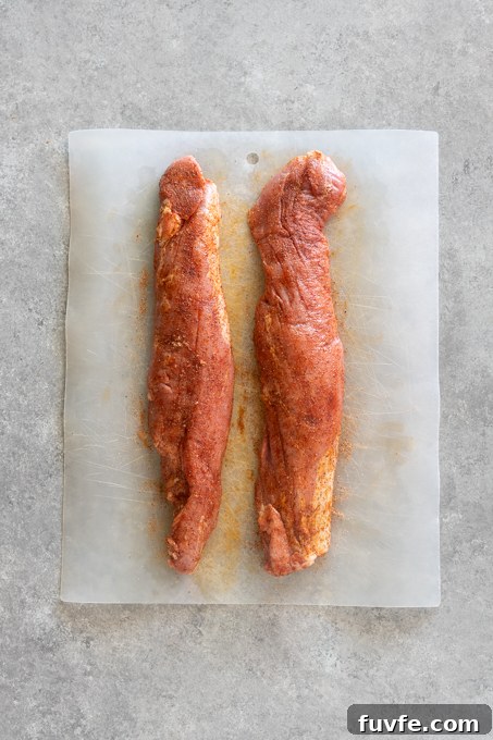 Pork tenderloins seasoned with spice rub.