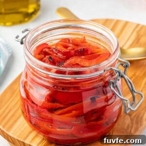 Roasted red peppers in a jar with olive oil