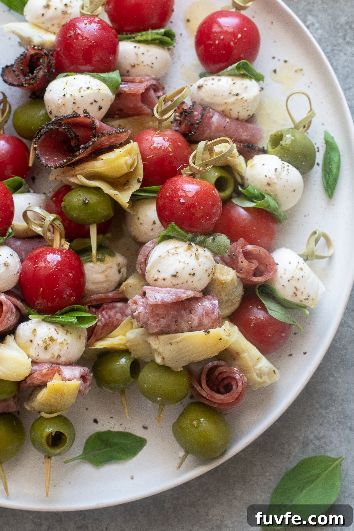 Antipasto skewers on a platter.