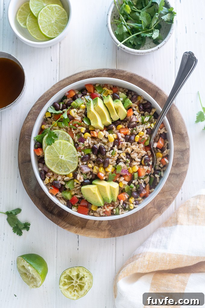 Brown rice salad with avocado and lime on top