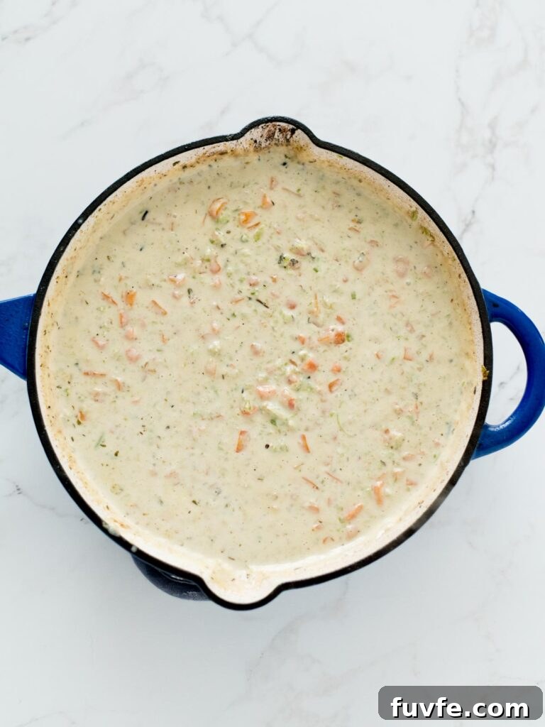 Creamy Chicken and Wild Rice Soup Recipe for Comforting Weeknights 8 vegetable mixture with flour and cream