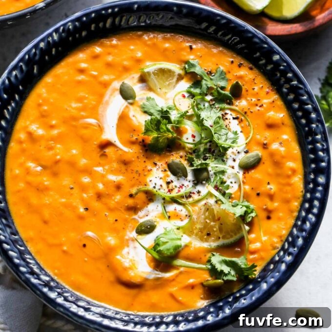 Pumpkin red lentil soup in a bowl.