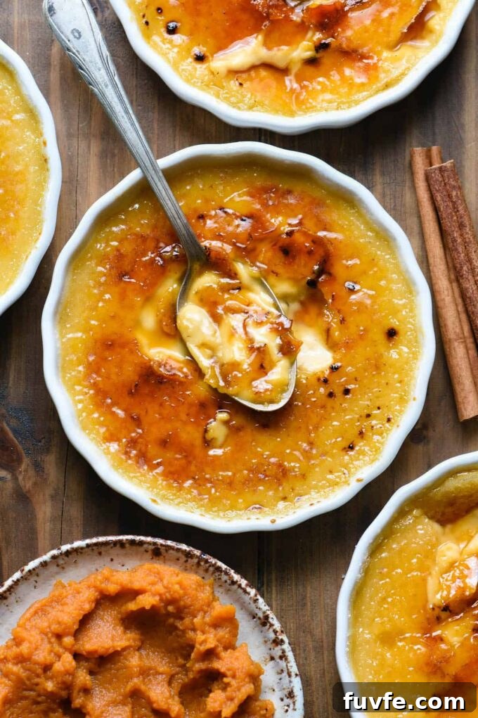 Pumpkin creme brulee with spoon digging in.