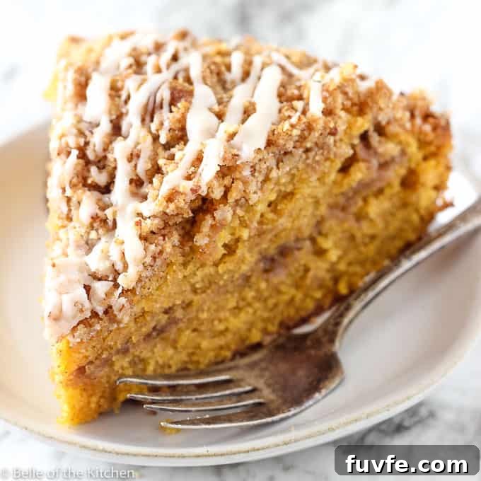 Slice of pumpkin spice coffee cake on a plate.