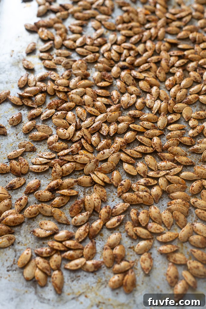 Oven roasted pumpkin seeds on a baking sheet