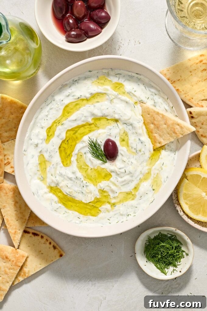 Authentic Greek Tzatziki: Creamy Cucumber-Yogurt Sauce 7 Greek tzatziki sauce topped with olive oil, dill and kalamata olive on top.
