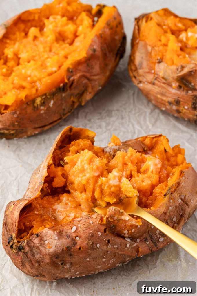 How to Bake Sweet Potatoes for Tender, Caramelized Flavor 7 Oven baked sweet potatoes with a fork fluffing one up