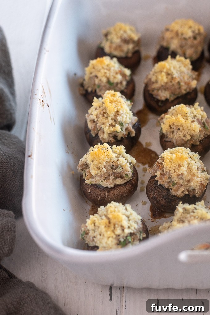 Stuffed mushrooms with sausage in baking dish