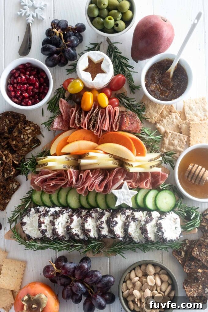 Christmas tree charcuterie board with baby tree star tree topper