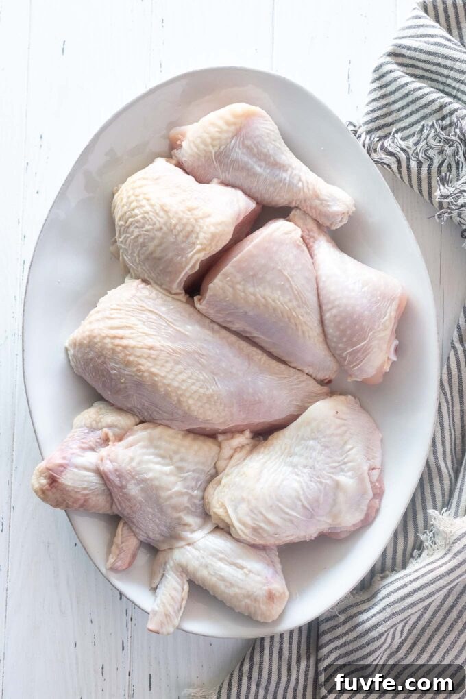 How to Cut Up a Whole Chicken: Step-by-Step Guide 2 Whole chicken cut up on a platter