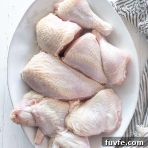 Whole chicken cut up on a platter