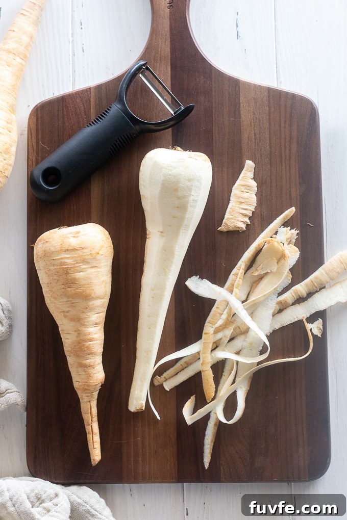Parsnip Recipes: Cooking, Storage and Produce Guide 4 Peeled parsnips on a cutting board