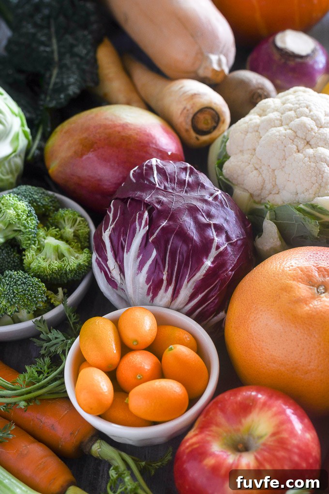Winter produce including kumquats, radicchio, orange, apple and more