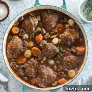 Classic Coq au Vin Recipe: French Red Wine Braised Chicken 9 Coq au vin in a Dutch oven.