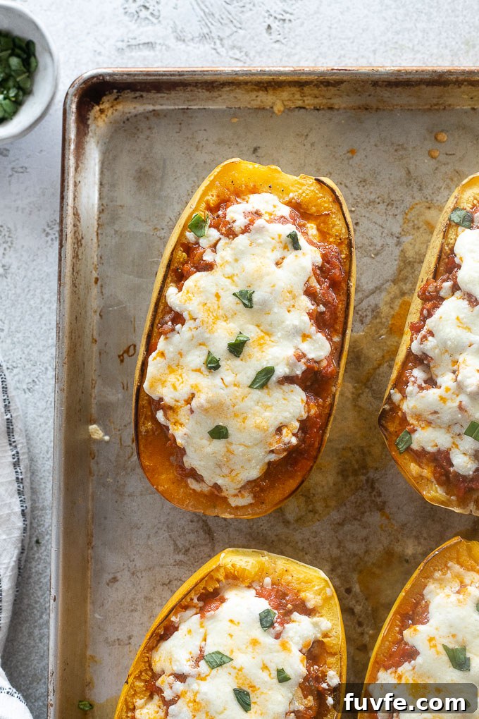 Spaghetti squash lasagna on a sheet pan garnished with basil
