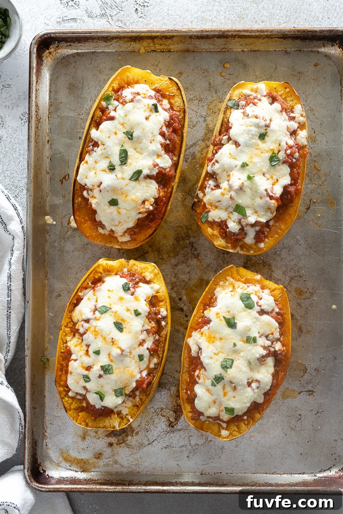 Spaghetti squash lasagna boats on a baking sheet