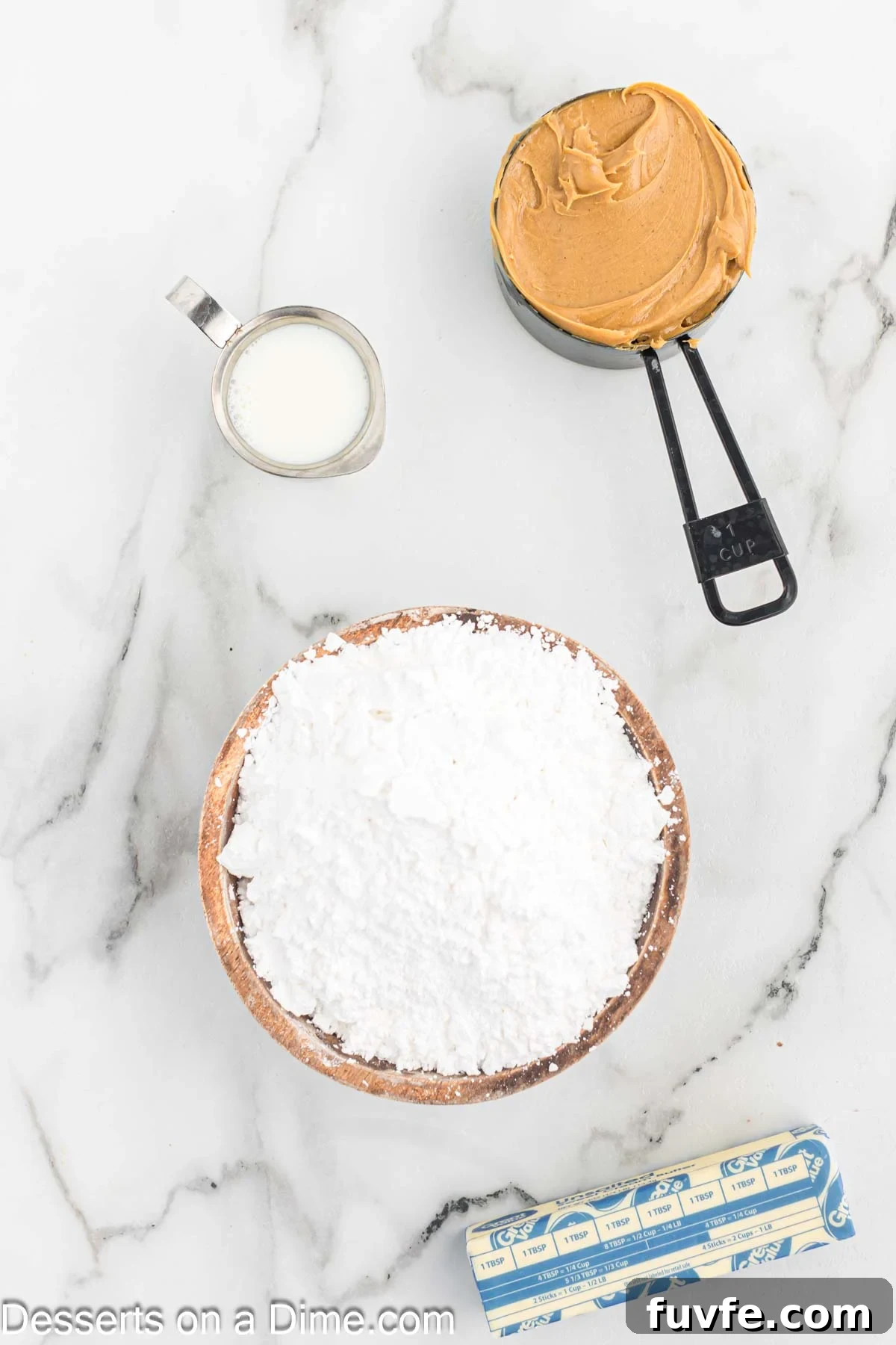 Ingredients for recipe - butter, peanut butter, milk, powdered sugar.