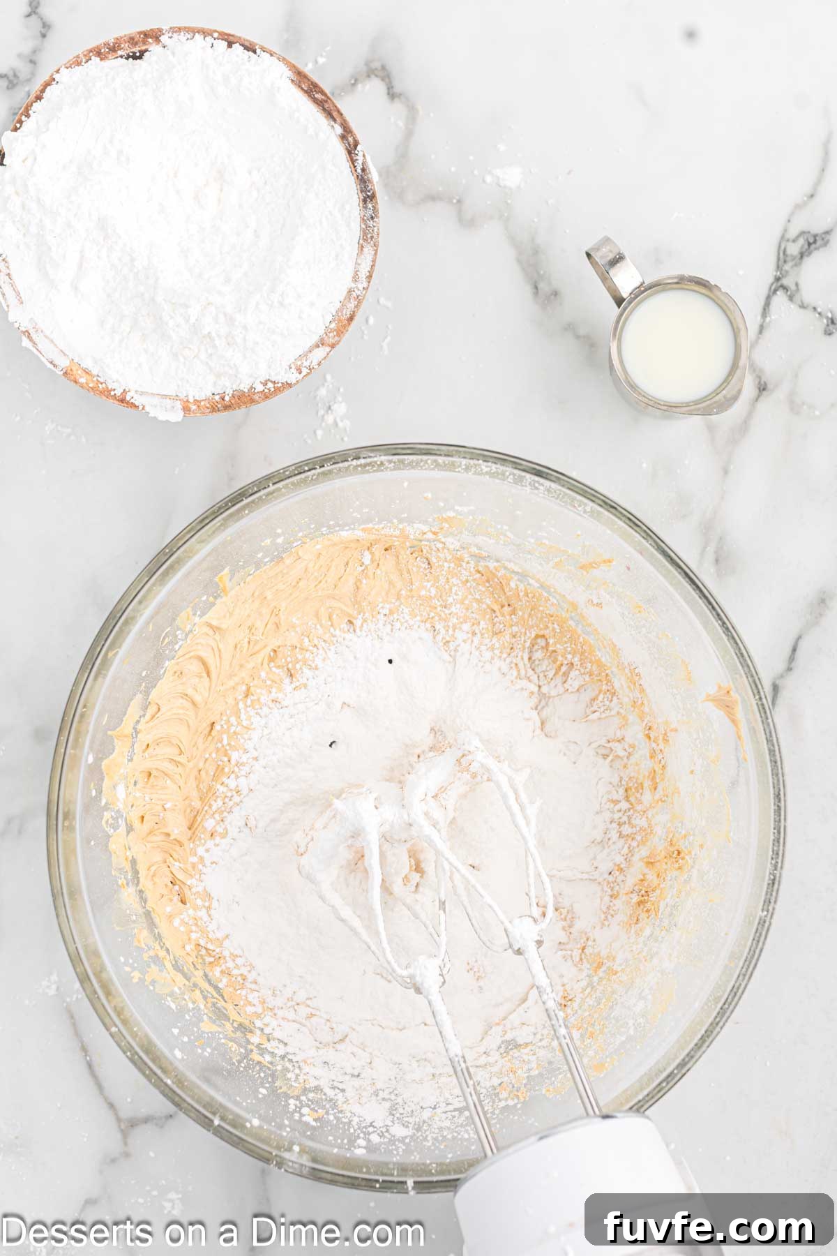 Powdered sugar added to bowl.