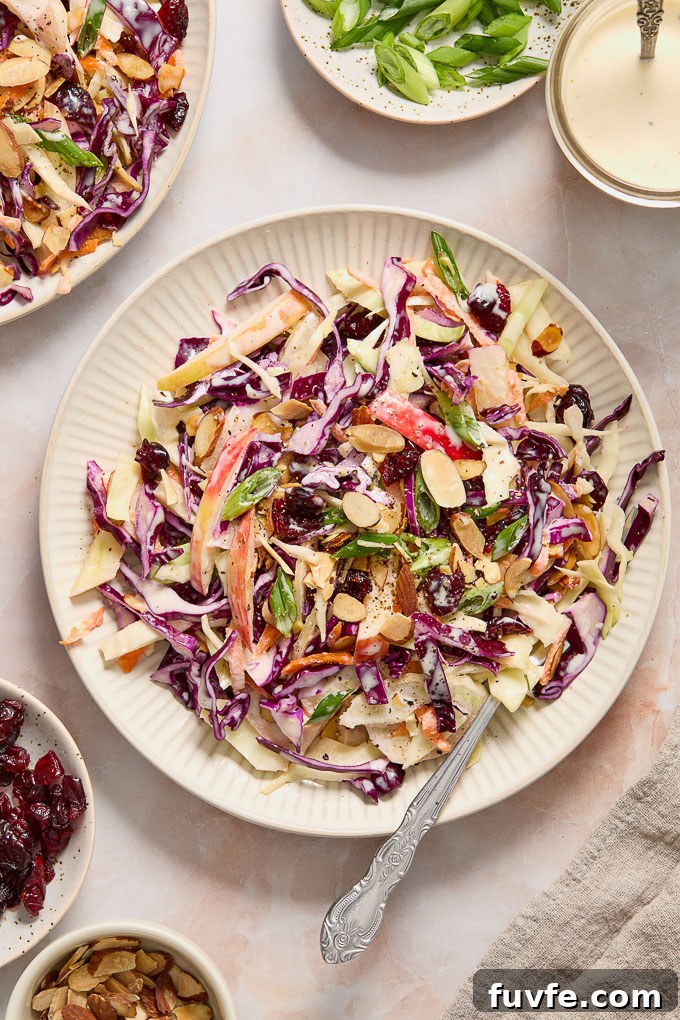 Fennel and apple slaw on a plate with a fork
