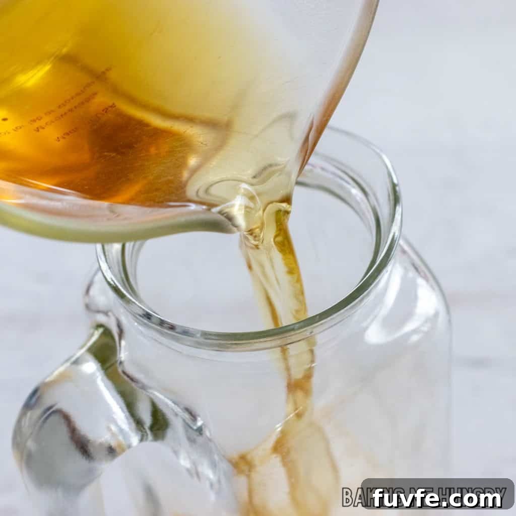 white tea being poured into pitcher