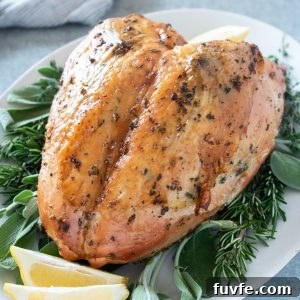 Herb and garlic roasted turkey breast on a serving platter