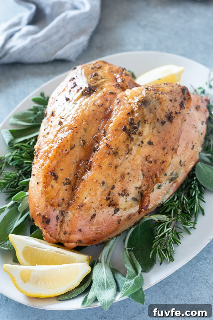 Roast turkey breast on a white serving platter