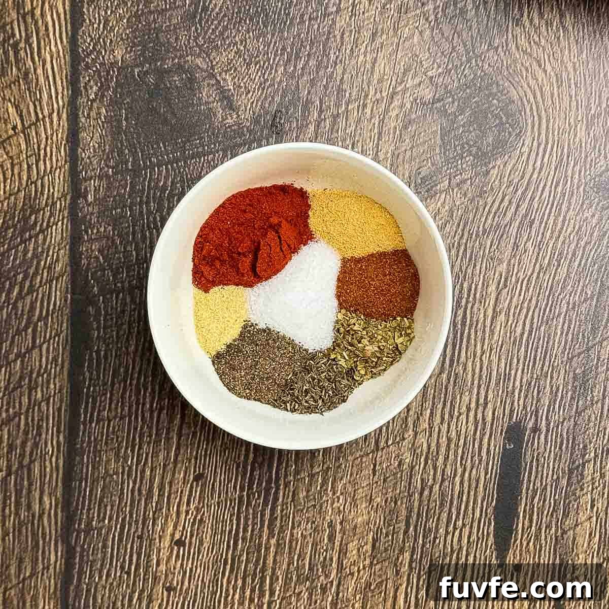 The ingredients for the blackened seasoning in a small bowl.
