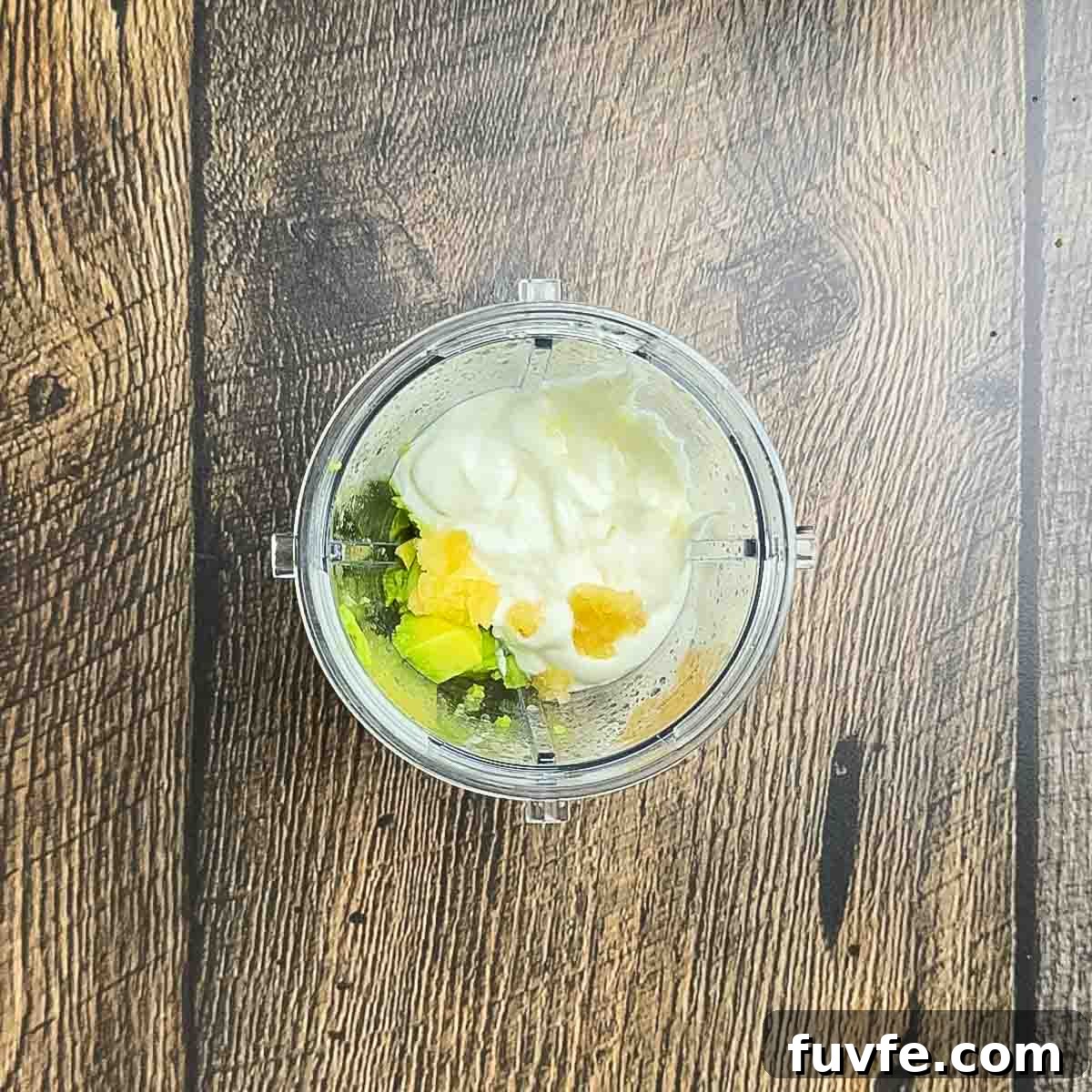  The ingredients for the avocado lime crema in a blender.