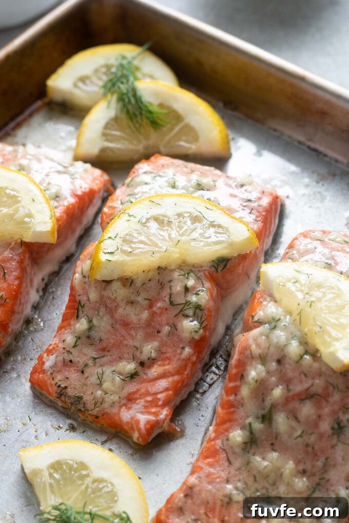 Pan-Seared Garlic Butter Salmon with Lemon 6 Salmon with lemon garlic butter on a sheet pan.