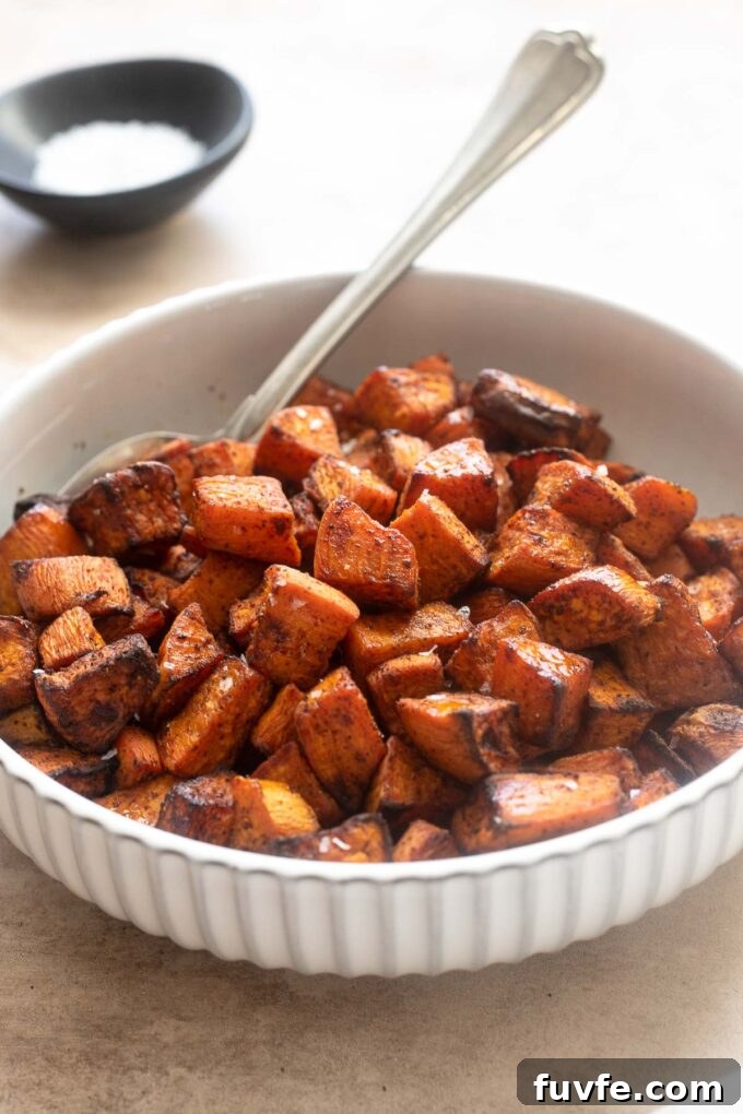 Crispy Air Fryer Sweet Potatoes 7 Air fryer roasted sweet potato cubes in a serving bowl.