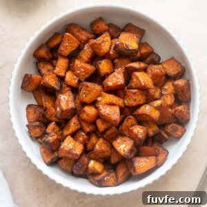 Air fryer roasted sweet potatoes in a white bowl.