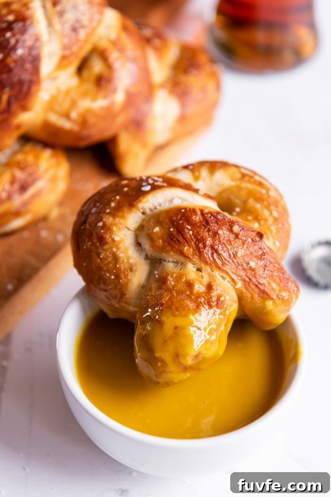 Soft Pretzel Recipe with Maple Mustard Dipping Sauce 7 Soft pretzel dunked in maple mustard sauce