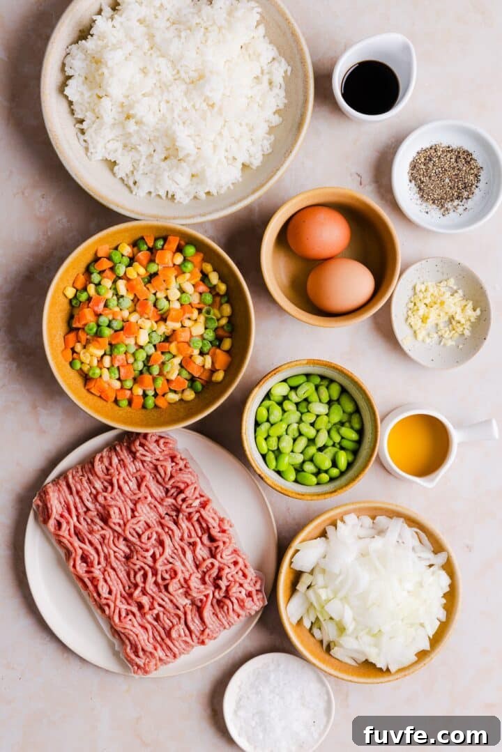 Savory Ground Turkey Fried Rice Recipe — Quick Weeknight Meal 4 Ingredients for turkey fried rice displayed in small bowls on a beige kitchen counter