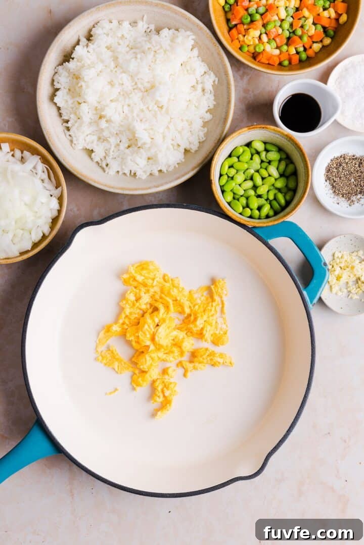 Savory Ground Turkey Fried Rice Recipe — Quick Weeknight Meal 5 Scrambled eggs cooked in a large ceramic pan