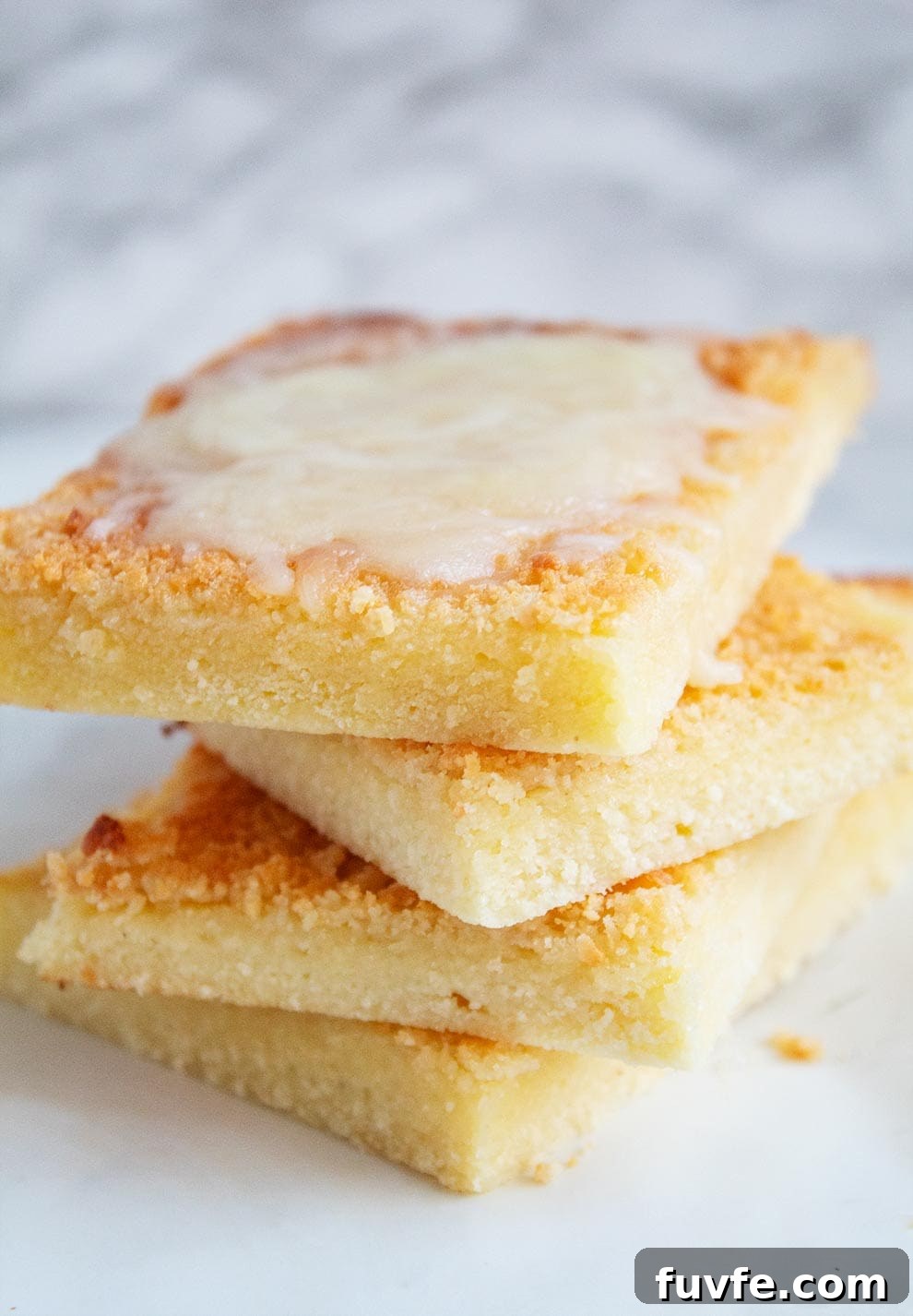 several slices of stacked keto garlic flatbread with melted mozzarella cheese on top