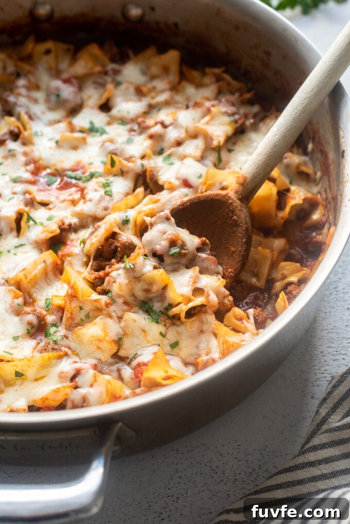 Cabbage and Ground Beef Casserole Without Rice 6 Low carb cabbage roll casserole in a skillet with wooden spoon.