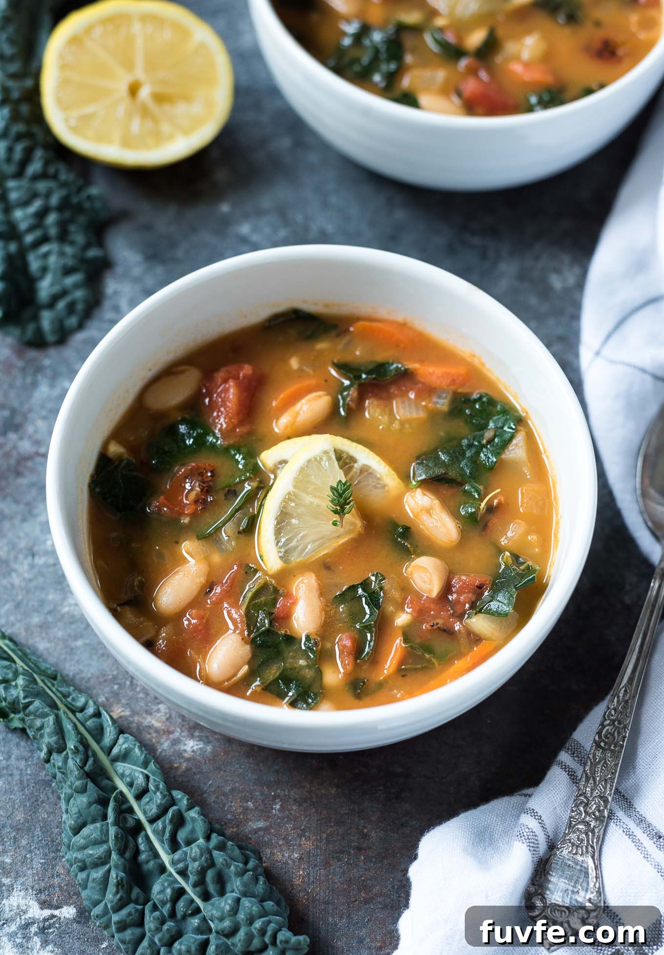 What's In Season in March: Fresh Produce Guide 26 White bean and kale soup in a bowl with lemon and thyme