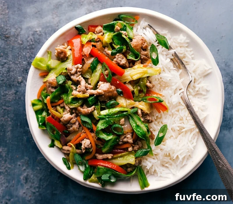 Egg roll in a bowl filling served over a bed of rice, prepared and ready for a delicious meal.