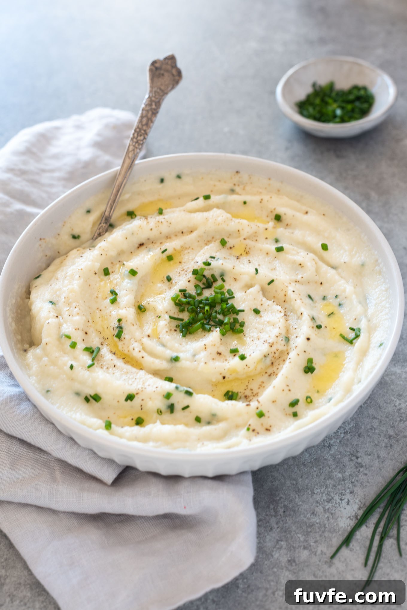 April Produce Guide: What's Fresh This Month 8 Bowl of garlic mashed cauliflower with spoon digging in