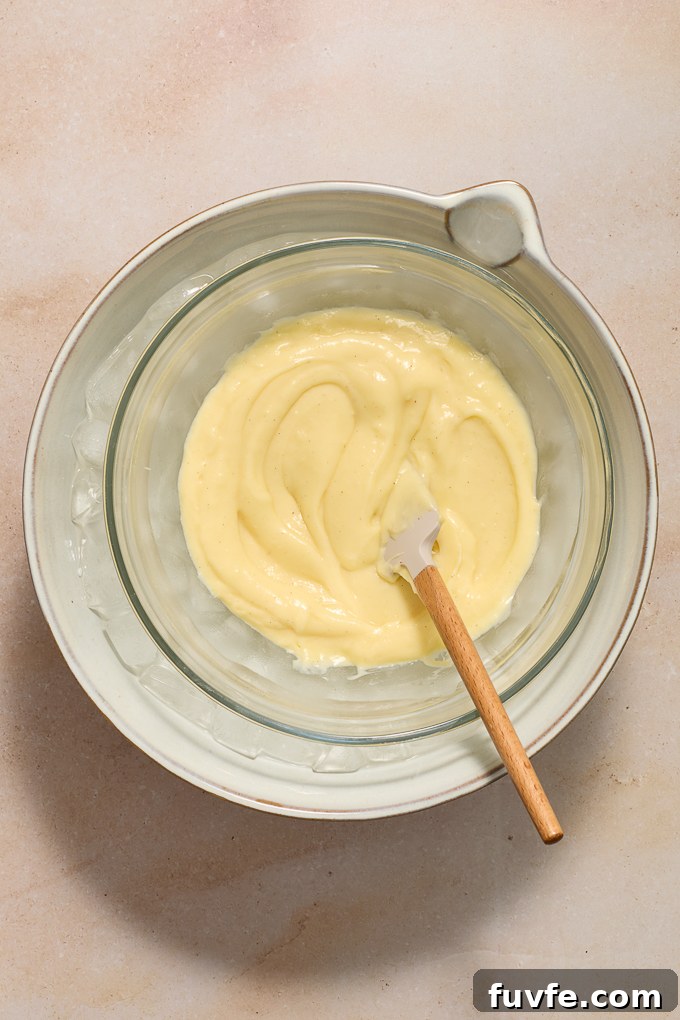 Silky Pastry Cream (Crème Pâtissière) Recipe 12 Strained pastry cream in ice bath.