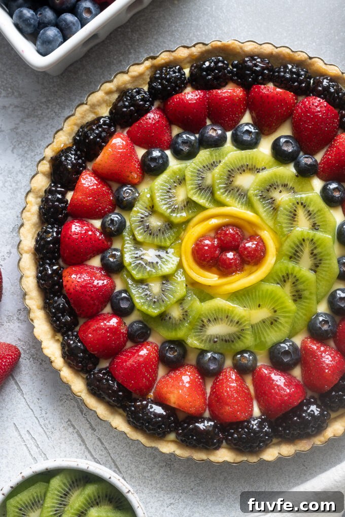 French fruit tart with pastry cream and fresh fruit.