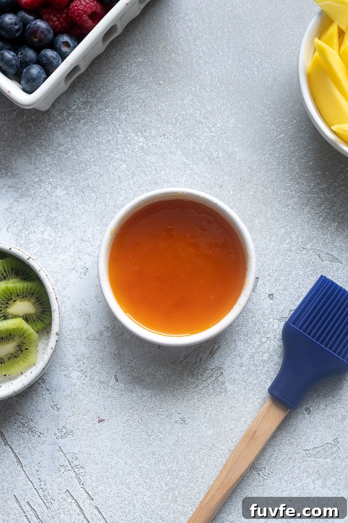Apricot jelly warmed in a ramekin.
