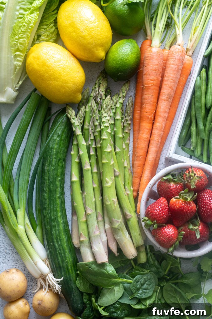 May seasonal produce including asparagus, strawberries and carrots.