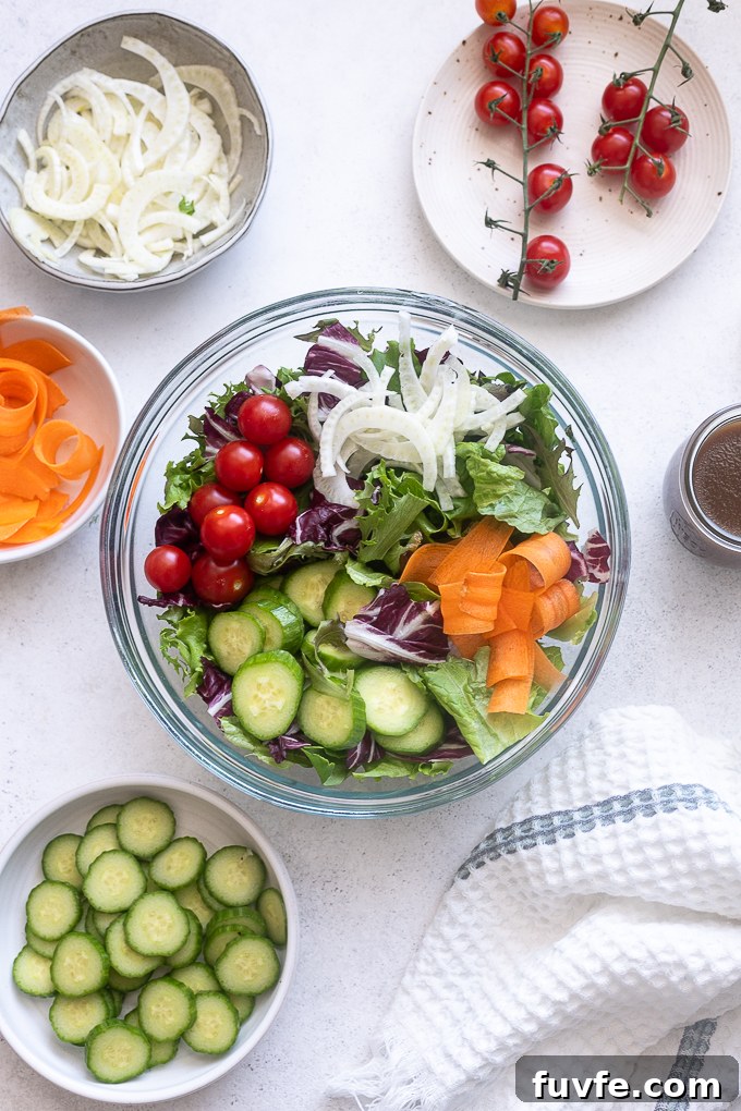 Insalata mista salad ingredients in a mixing bowl.