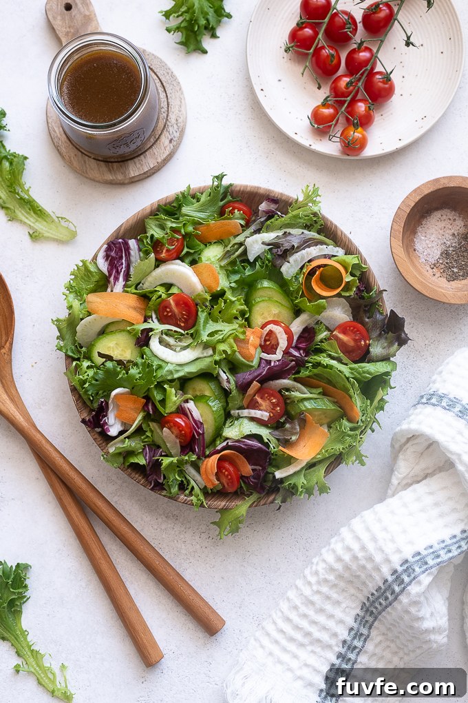 Italian green salad tossed in a serving bowl.