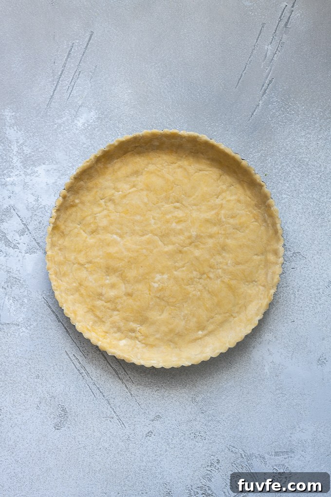 Pate sucree dough pressed into tart pan.