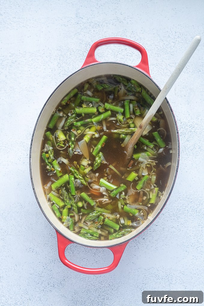 Spring Vegetable Soup Recipe with Asparagus, Peas and Mint 6 Aromatics with vegetable stock, asparagus and white beans.