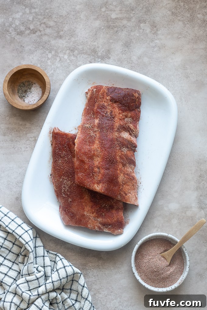 Fall-Off-the-Bone Slow-Cooker Baby Back Ribs 5 Baby back ribs seasoned with bbq rub.