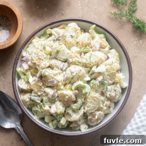 Dill pickle potato salad in a serving bowl.