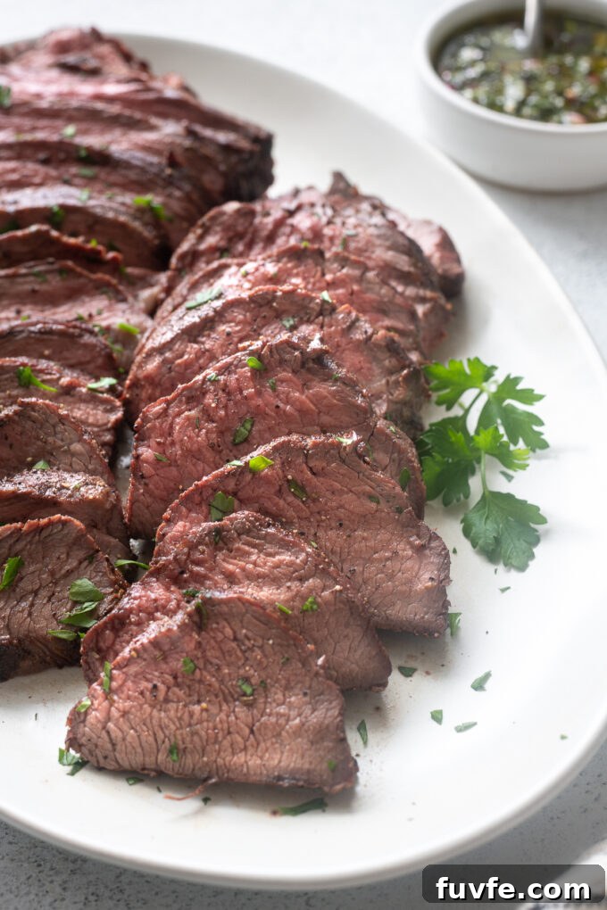 Santa Maria grilled tri tip roast sliced on a platter.